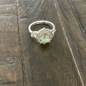 silver and light green ring